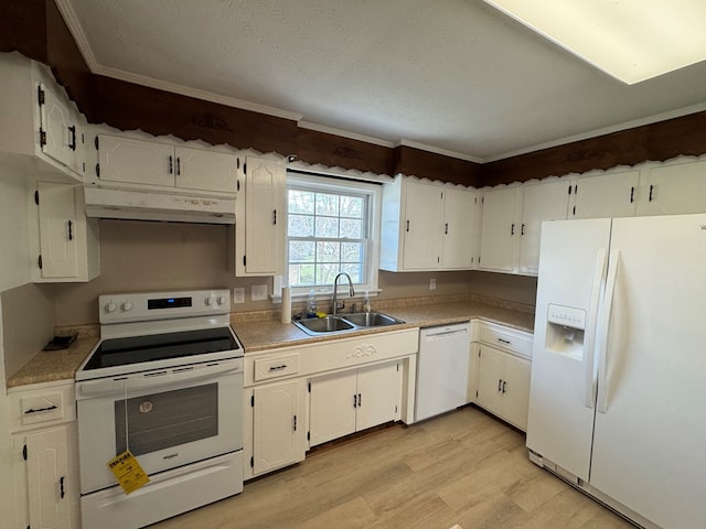 kitchen with white appliances, a sink, under cabinet range hood, white cabinetry, and light wood-type flooring