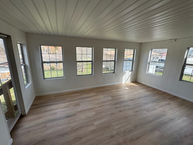 unfurnished sunroom featuring wooden ceiling