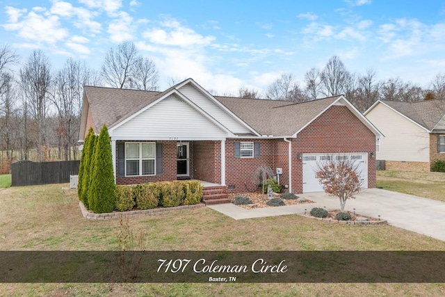 single story home with a garage, brick siding, a front yard, and fence