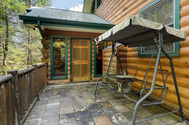 property entrance with metal roof