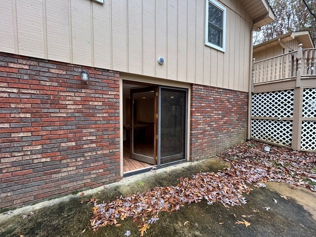 exterior space featuring brick siding