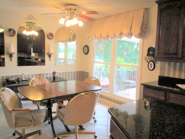 dining room featuring a ceiling fan and light tile patterned flooring