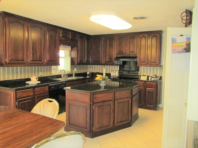 kitchen featuring visible vents, a kitchen island, under cabinet range hood, black appliances, and a sink