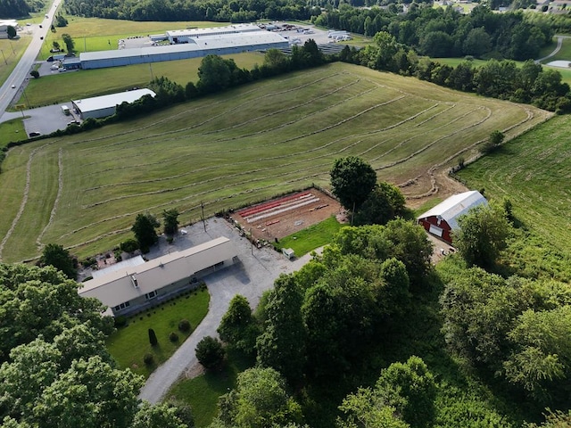 birds eye view of property with a rural view