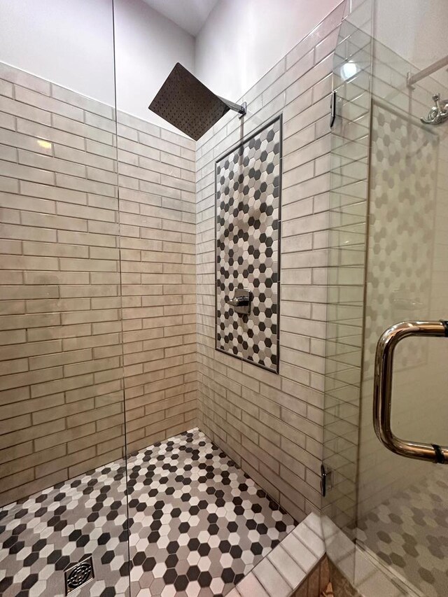 bathroom with a shower stall