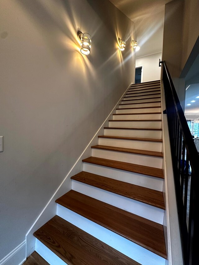 stairs featuring baseboards