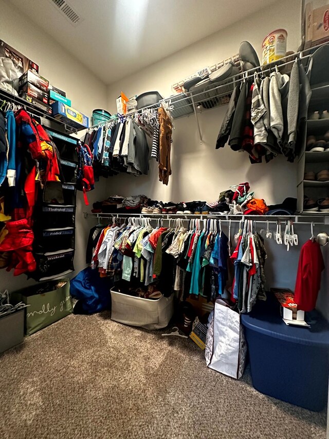 walk in closet with carpet and visible vents