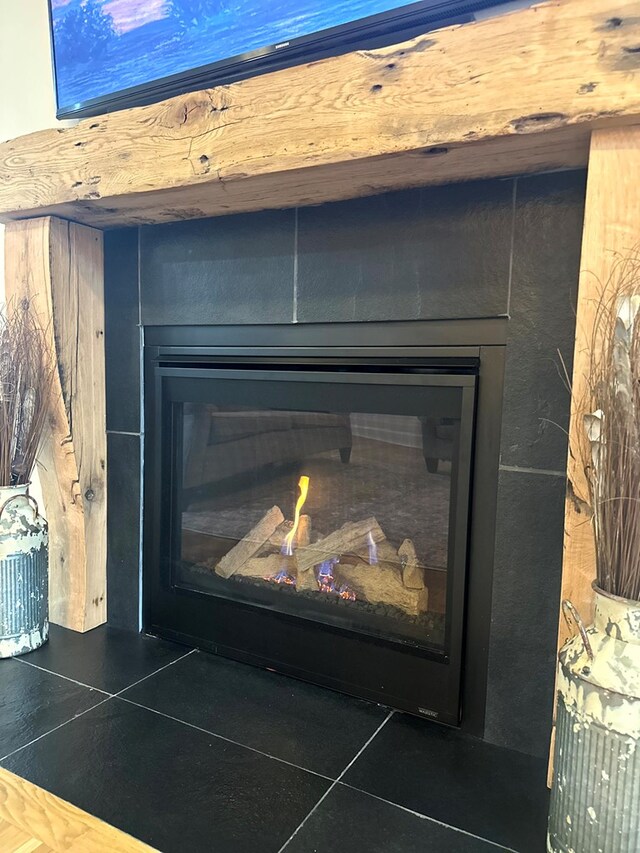 room details featuring a glass covered fireplace