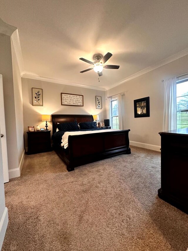 bedroom with multiple windows, carpet flooring, and crown molding