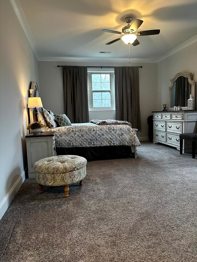 carpeted bedroom with ornamental molding, visible vents, and baseboards