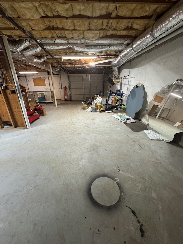 garage with concrete block wall