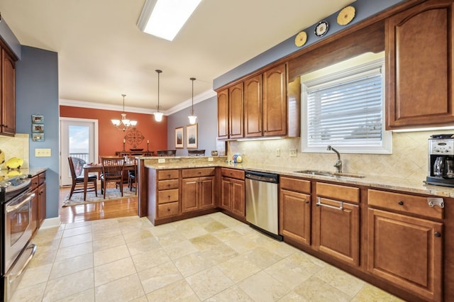 kitchen with appliances with stainless steel finishes, brown cabinets, a peninsula, pendant lighting, and a sink