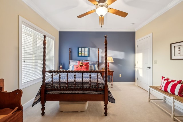 bedroom with ornamental molding, light colored carpet, baseboards, and a ceiling fan