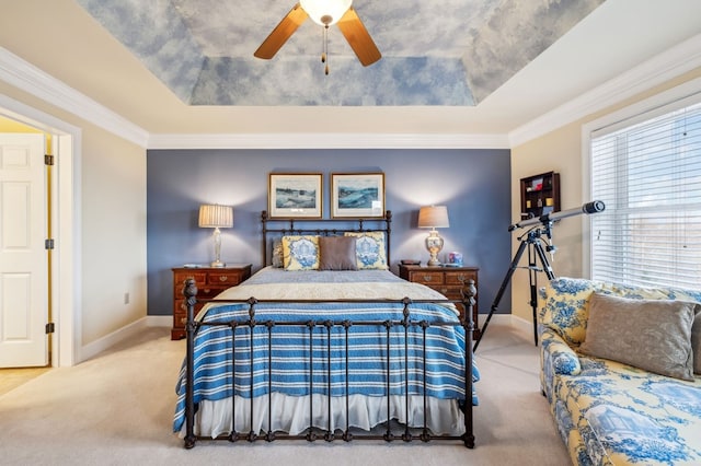 bedroom featuring light carpet, multiple windows, and a raised ceiling