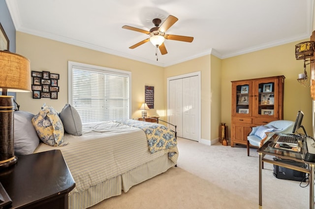 bedroom featuring light colored carpet, a ceiling fan, baseboards, a closet, and crown molding