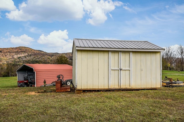 view of shed featuring a mountain view