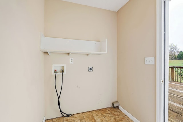 clothes washing area featuring baseboards, laundry area, washer hookup, and hookup for an electric dryer