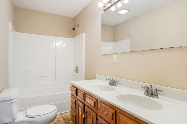 bathroom featuring washtub / shower combination, double vanity, a sink, and toilet