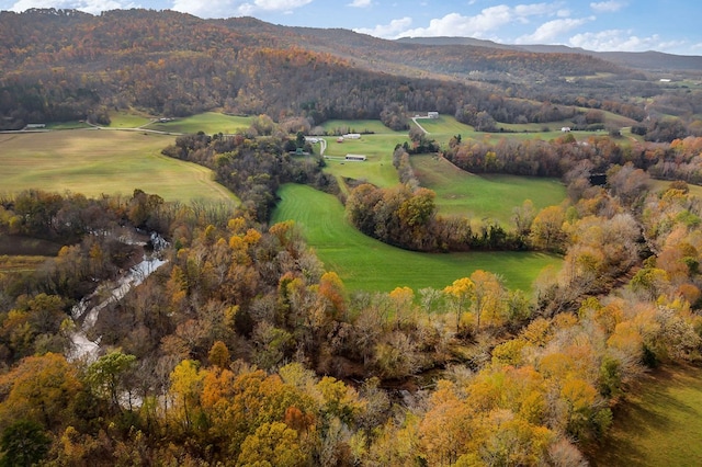 drone / aerial view featuring view of golf course and a mountain view