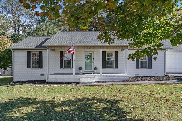 view of front of house with a porch, brick siding, crawl space, roof with shingles, and a front yard