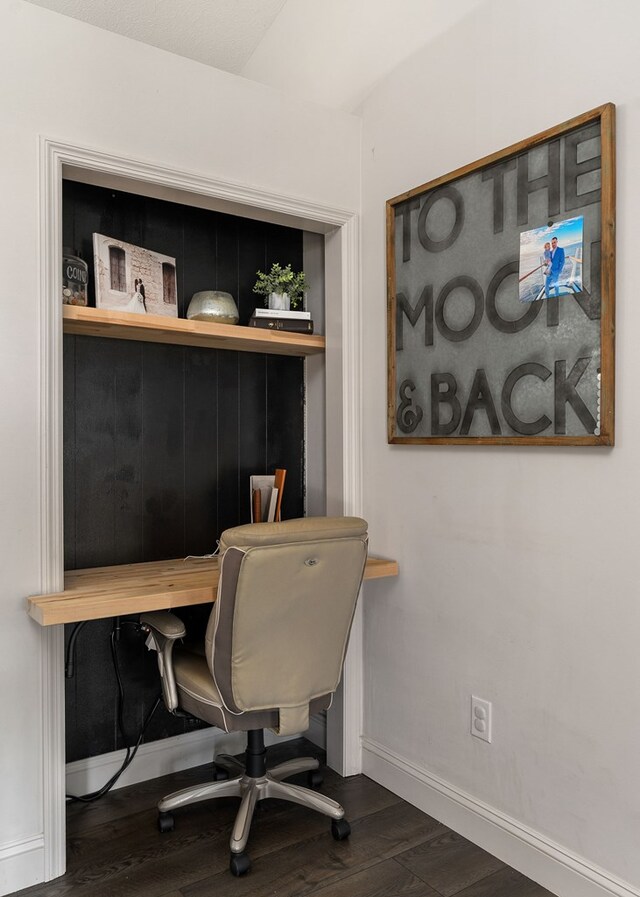 office area featuring dark wood finished floors and baseboards