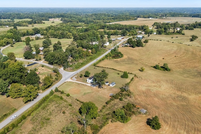 birds eye view of property with a rural view