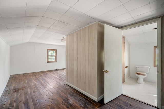 bonus room featuring lofted ceiling and dark wood-style flooring