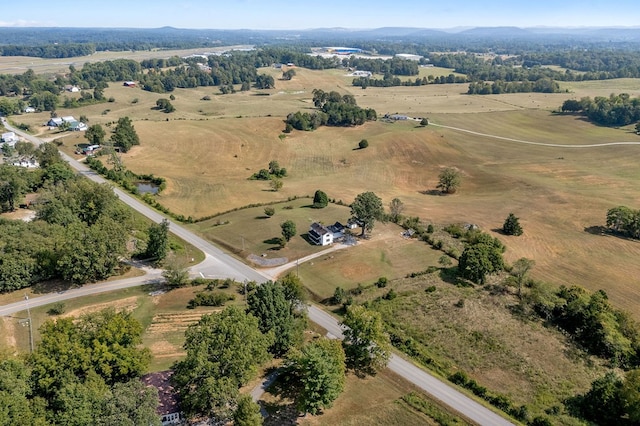 birds eye view of property with a rural view