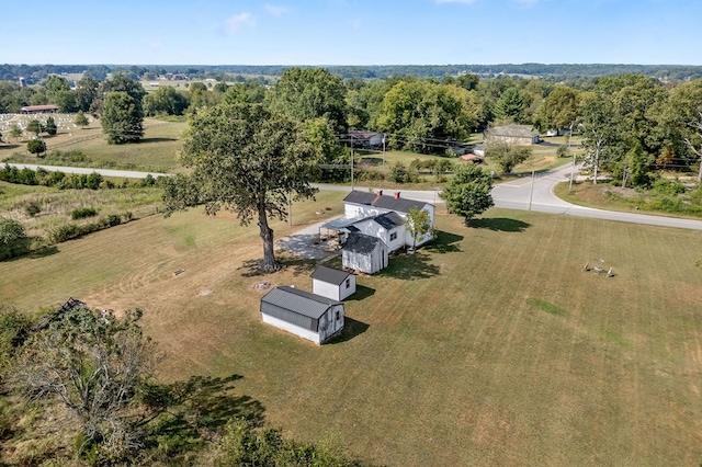 birds eye view of property with a rural view