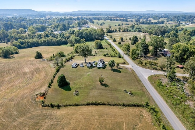 drone / aerial view with a mountain view and a rural view