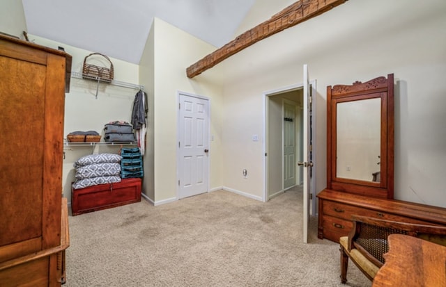 interior space featuring light colored carpet and baseboards