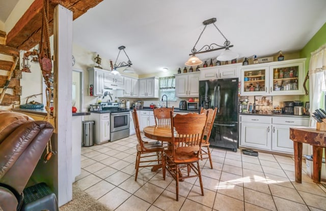 dining room with lofted ceiling and light tile patterned floors