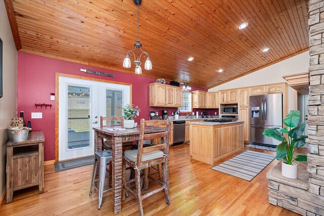 kitchen featuring french doors, hanging light fixtures, appliances with stainless steel finishes, a kitchen island, and wooden ceiling