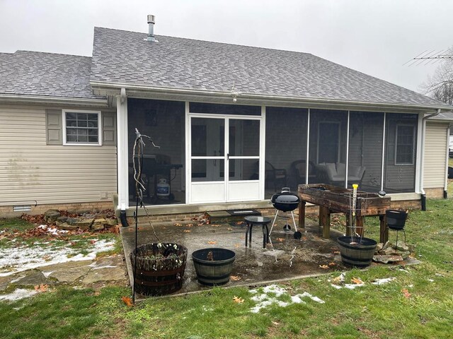 rear view of house with a sunroom, roof with shingles, and crawl space