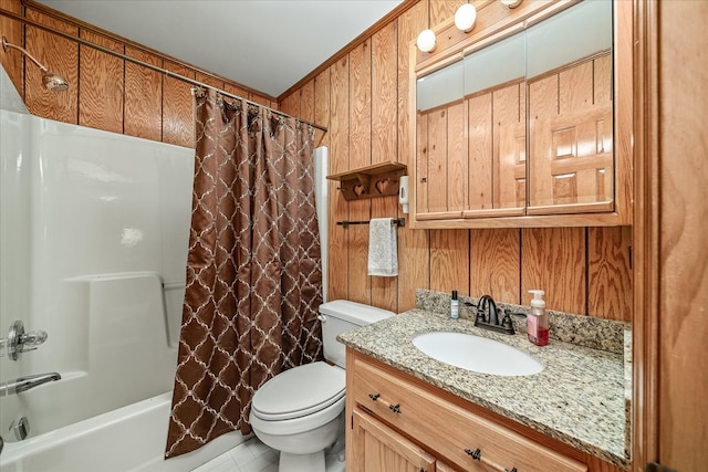 full bathroom featuring toilet, wood walls, shower / bath combo, and vanity