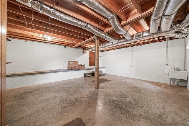 unfinished basement featuring a sink