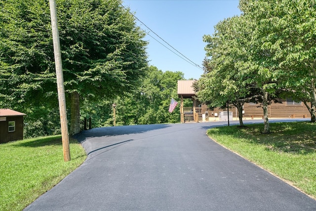 view of road featuring aphalt driveway