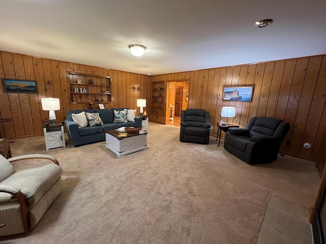 living room with carpet floors and wooden walls