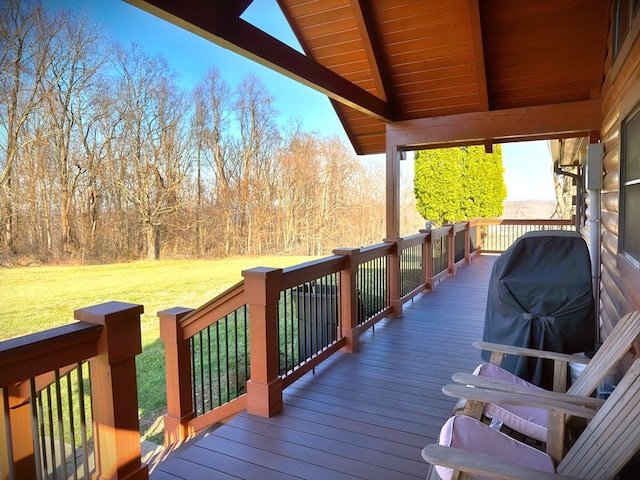 wooden terrace with a yard