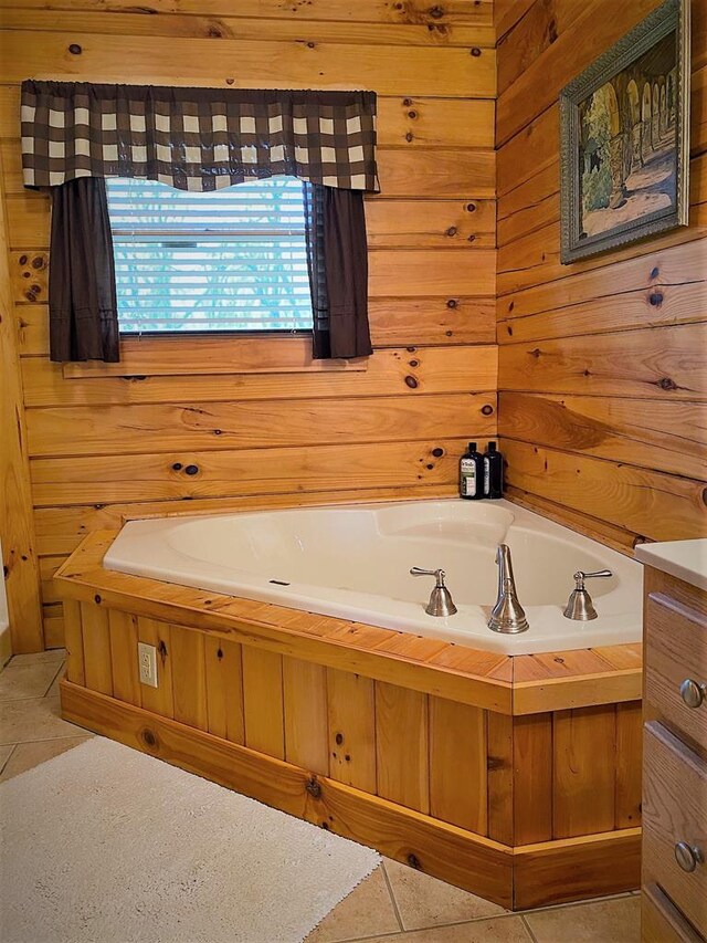 bathroom featuring tile patterned flooring, a bath, and wood walls