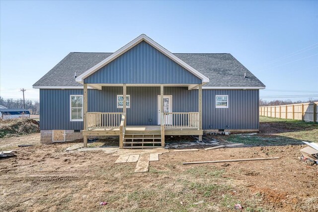 view of front of property featuring covered porch, roof with shingles, and crawl space