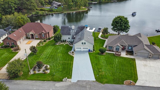 bird's eye view with a residential view and a water view