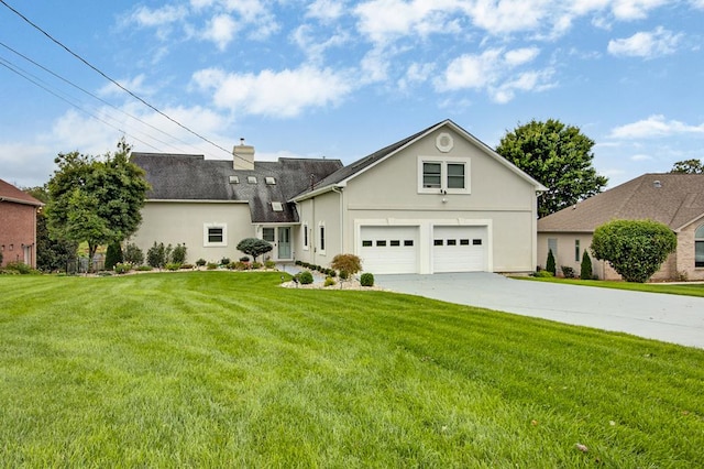 view of front facade with a garage, concrete driveway, a chimney, a front yard, and stucco siding