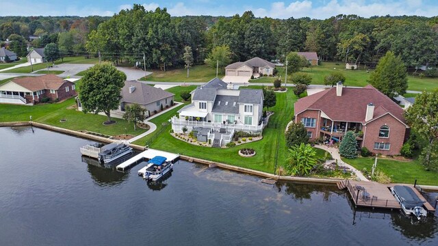 birds eye view of property featuring a residential view and a water view