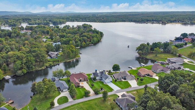 drone / aerial view with a water view and a residential view