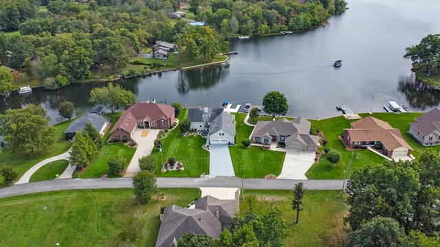 bird's eye view featuring a water view and a residential view