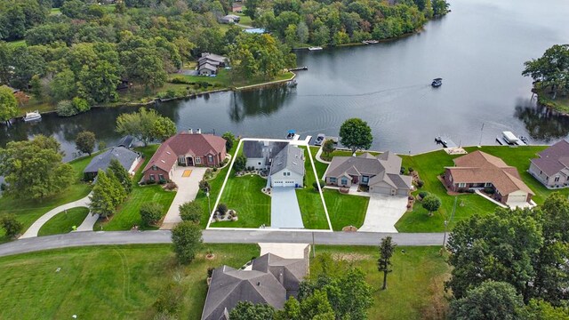 drone / aerial view with a water view and a residential view