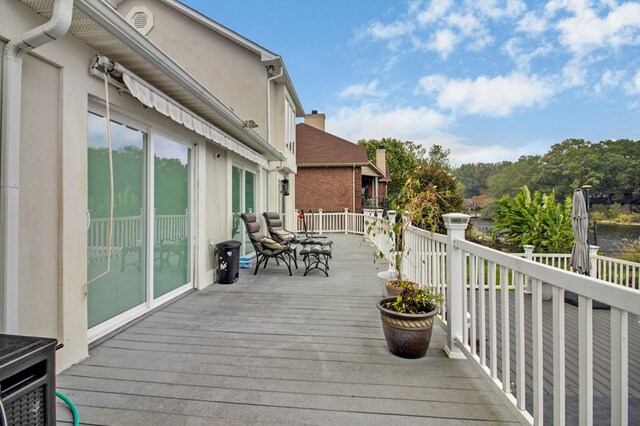 deck featuring outdoor dining area