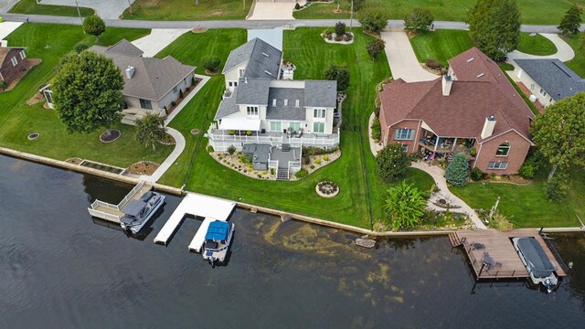 bird's eye view featuring a water view and a residential view