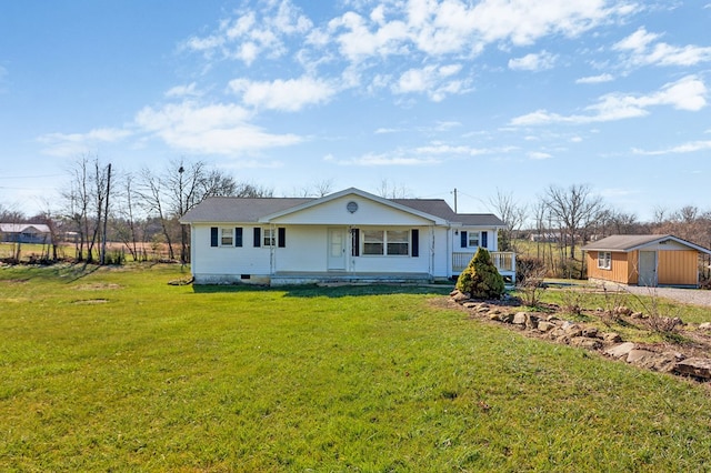 view of front of property with a porch, an outdoor structure, and a front lawn